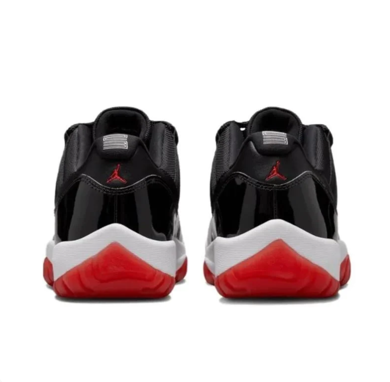 Jordan Black Low-Top Sneakers with Glossy Panels and Red Outsole